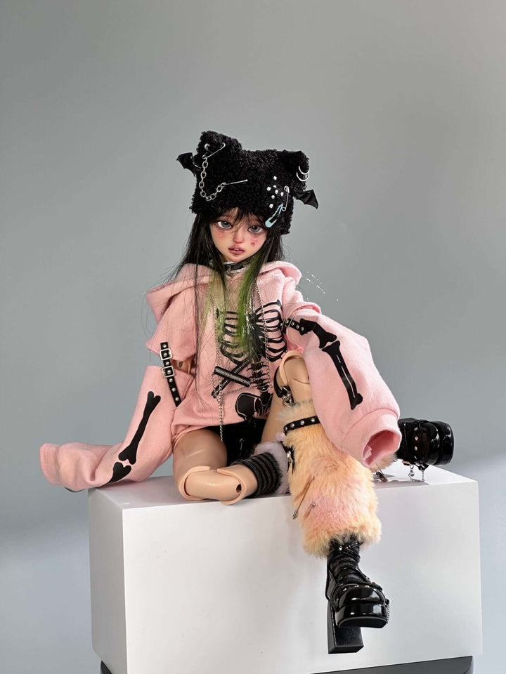 KiKi BJD doll wearing elegant outfit, with detailed makeup and poseable resin body